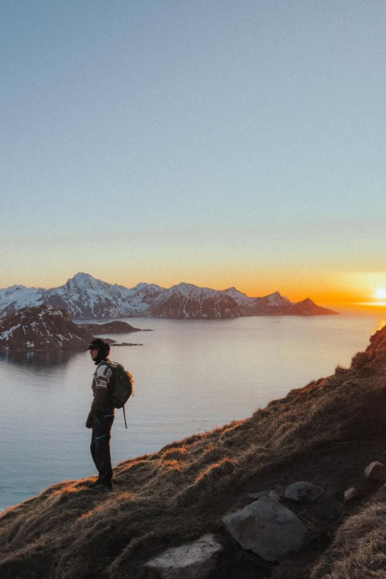 Ådne Birkeland wearing the Cortina Sweater on a hike in Lofoten during winter