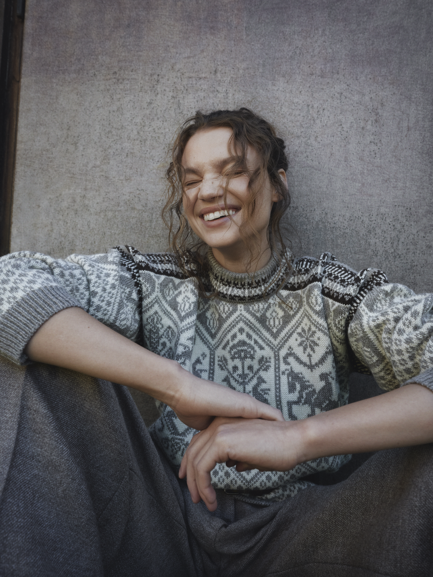 Smiling woman wearing 1994 Olympic Sweater from Dale of Norway
