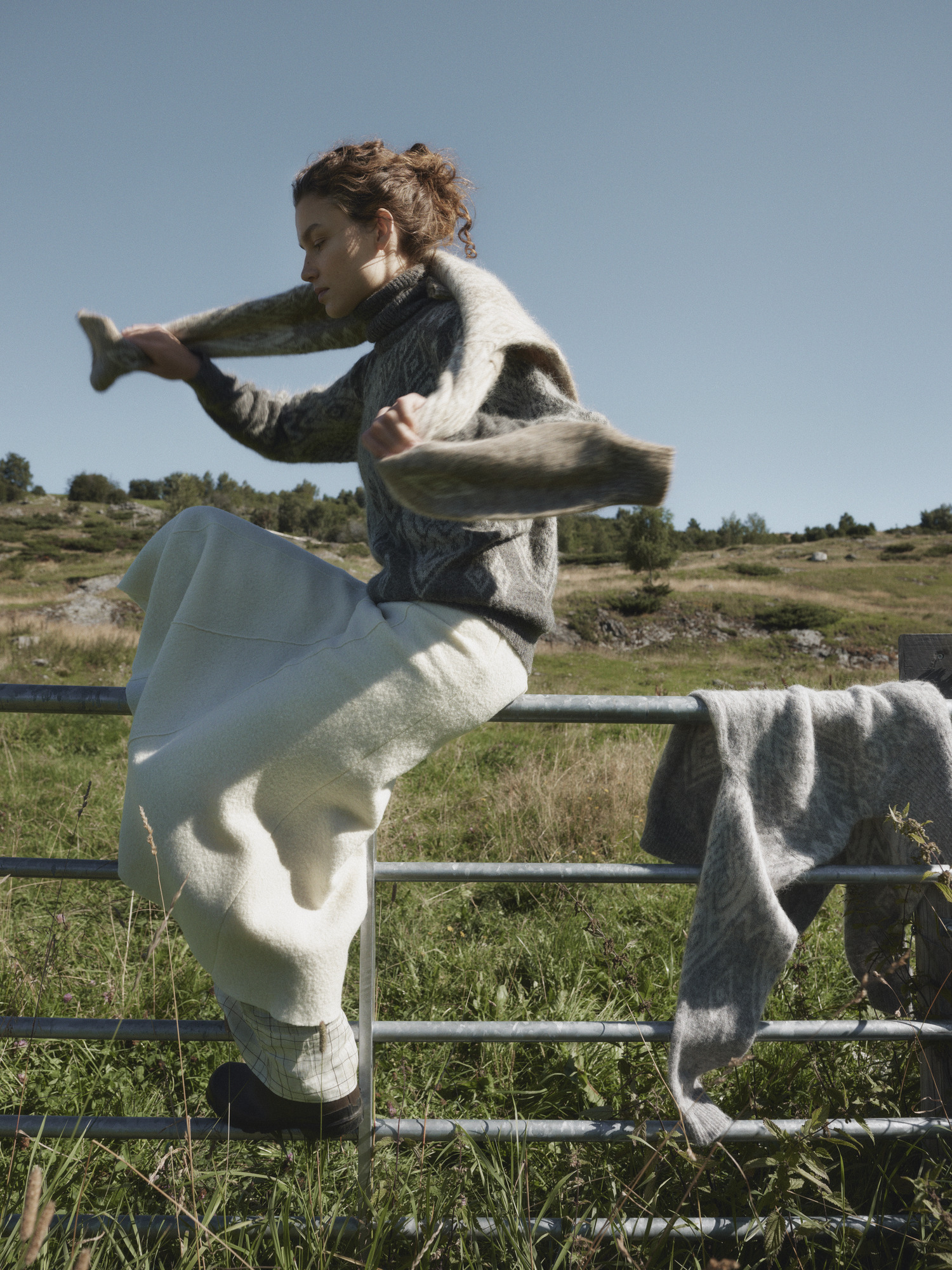 Falun sweater Dale of Norway, Female model running in the field